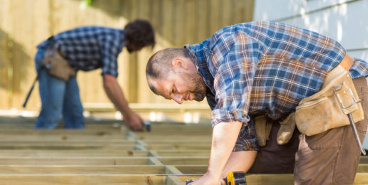 contractors working on construction of deck